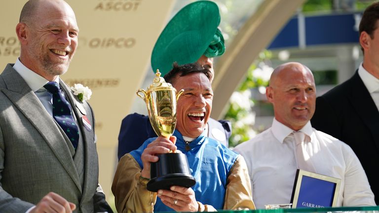 Frankie Dettori is awarded the Queen&#39;s Vase trophy by Zara and Mike Tindall