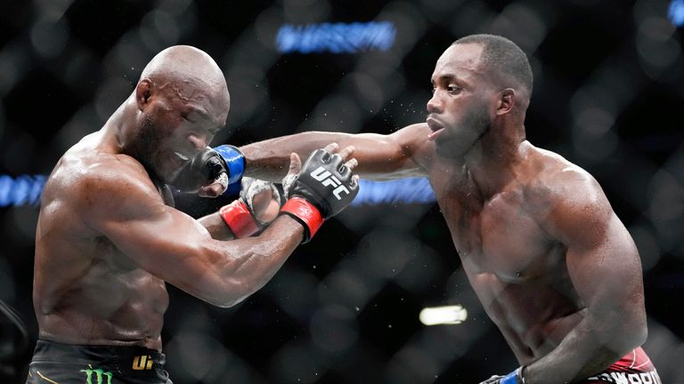 Nigerian UFC fighter Kamaru Usman, left, fights with UFC fighter Leon Edwards, of Jamaica, during their welterweight championship bout at UFC 278.