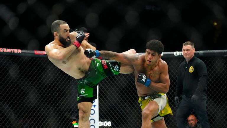 Gilbert Burns punches Belal Muhammed in a Welterweight bout during UFC 288.