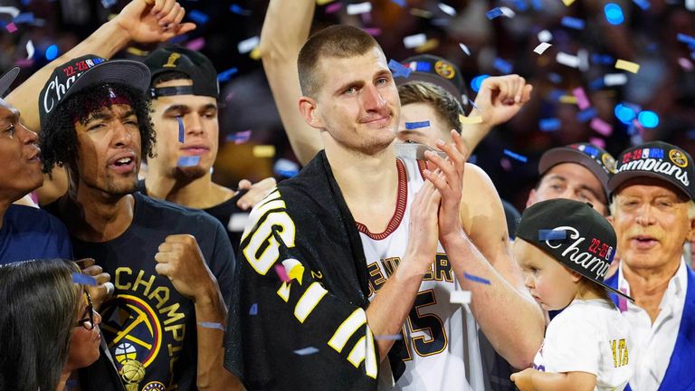 Nikola Jokic celebrates with his team-mates following the Denver Nuggets&#39; victory in the NBA Finals