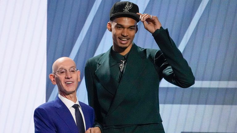 Victor Wembanyama poses for a photo with NBA commissioner Adam Silver after being selected first overall by the San Antonio Spurs during the NBA basketball draft, Thursday, June 22, 2023, in New York. (AP Photo/John Minchillo)